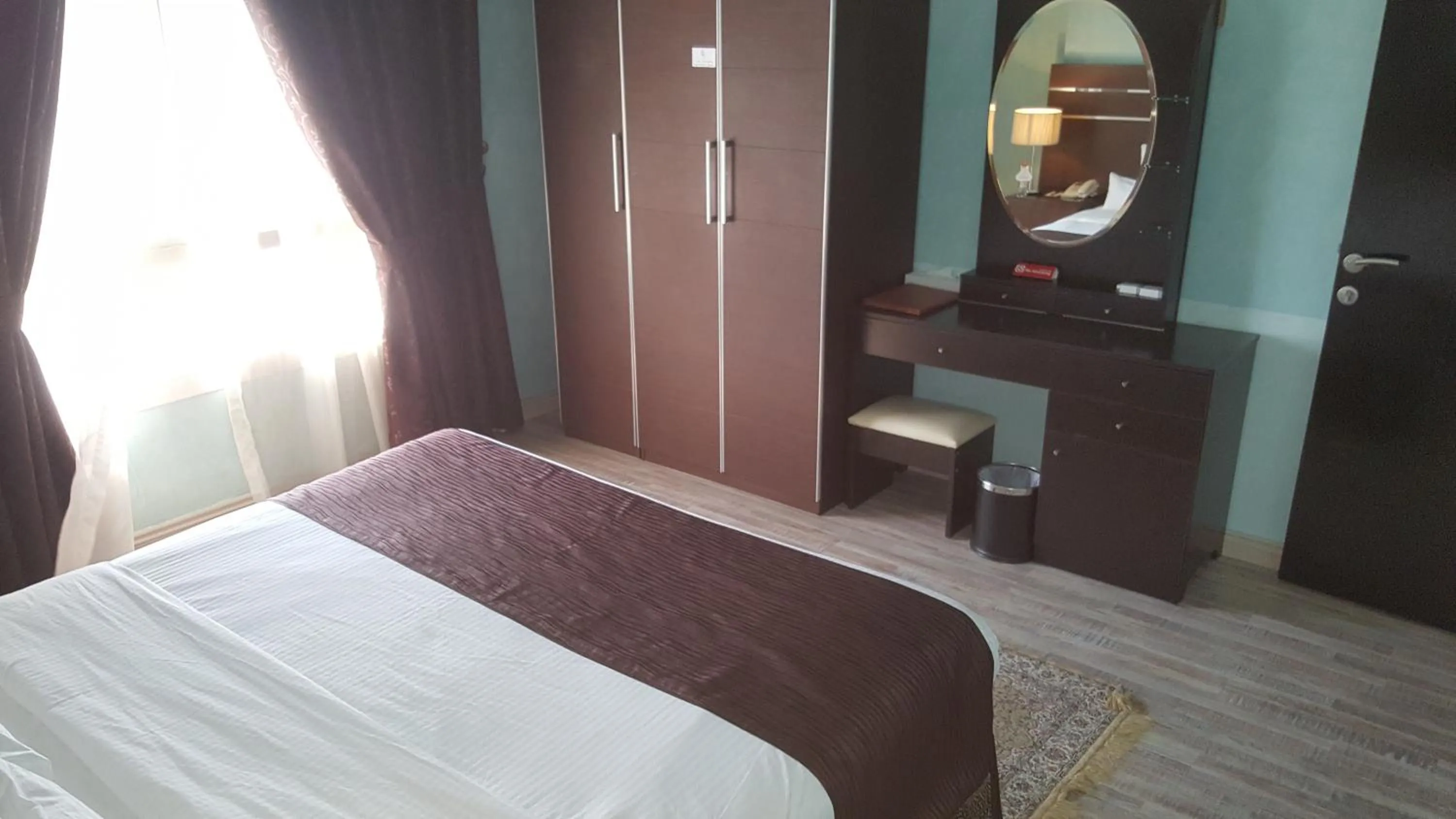 Bed in Boulevard City Suites Hotel Apartments