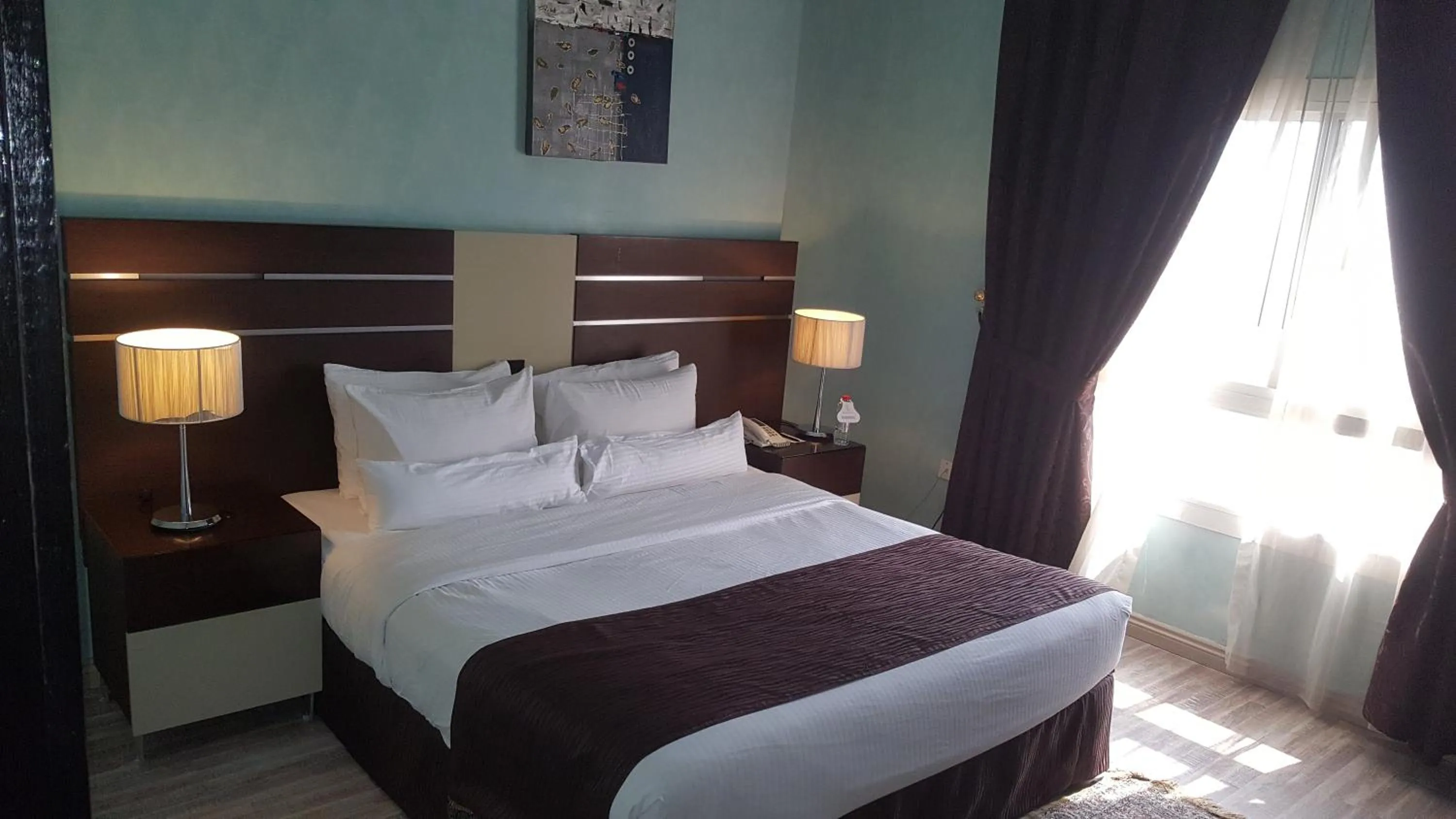 Bed in Boulevard City Suites Hotel Apartments