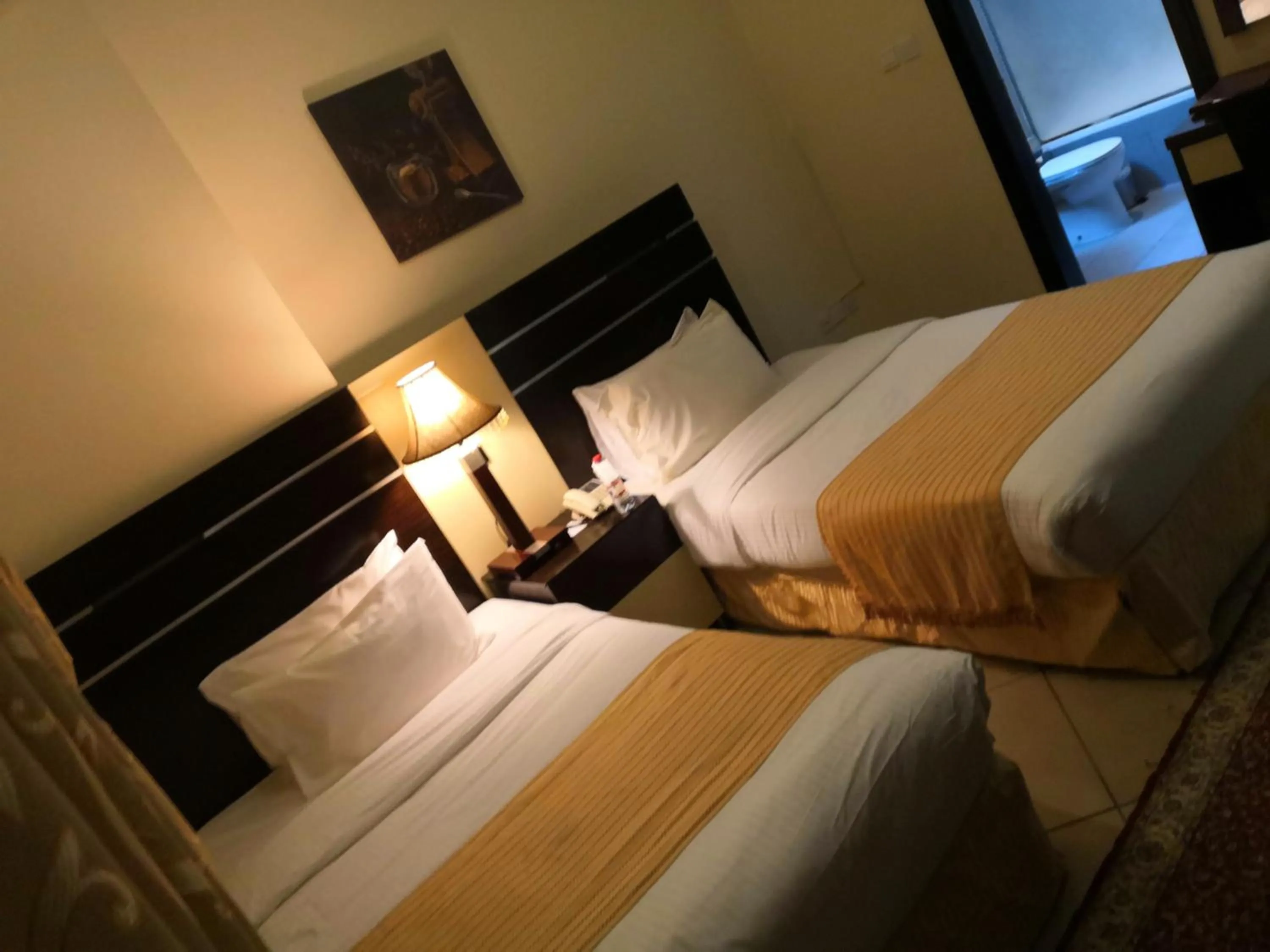 Bed in Boulevard City Suites Hotel Apartments