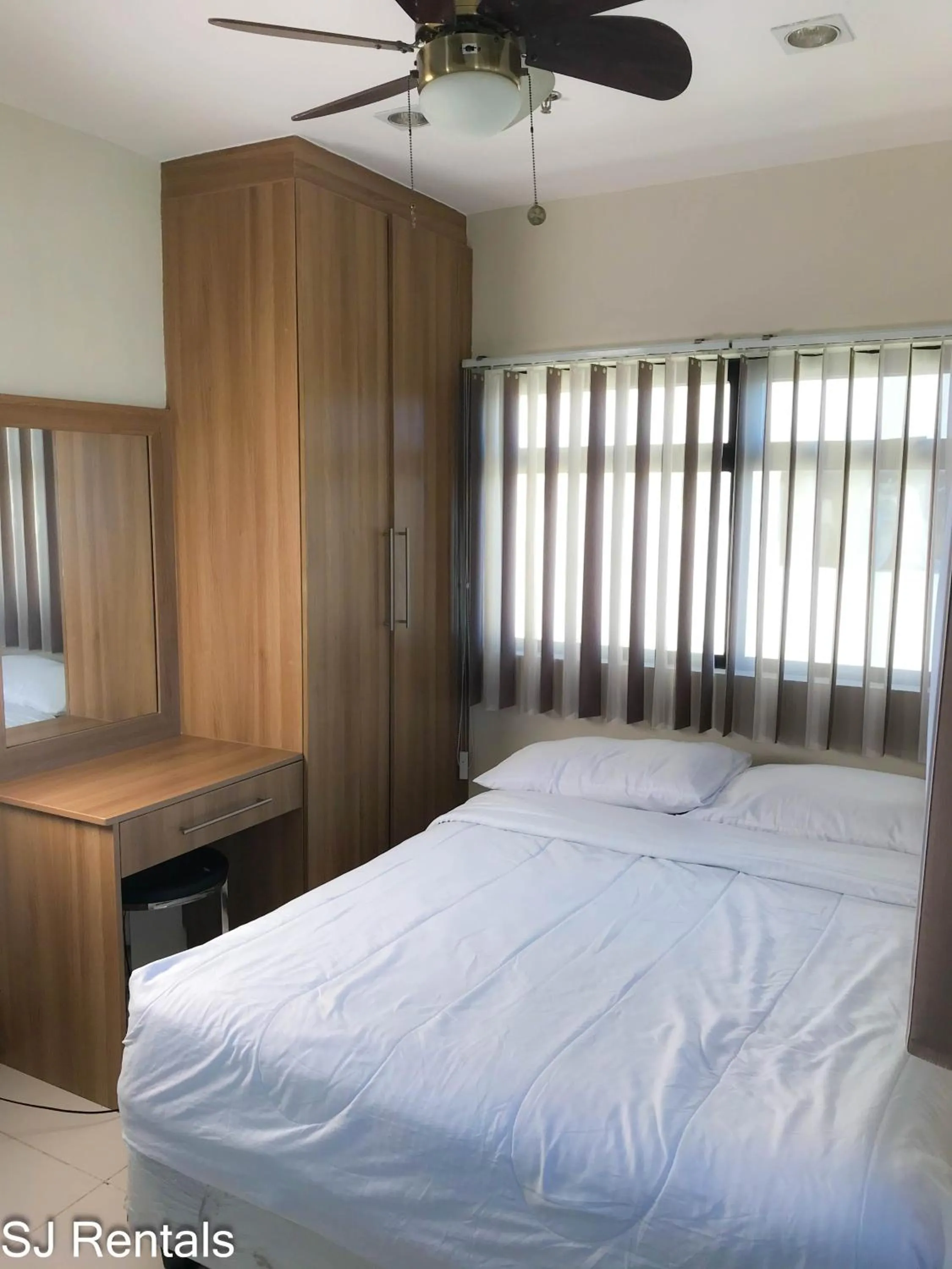 Bedroom, Bed in 2 Bedroom Condo @ Midpoint Residences w/ City View