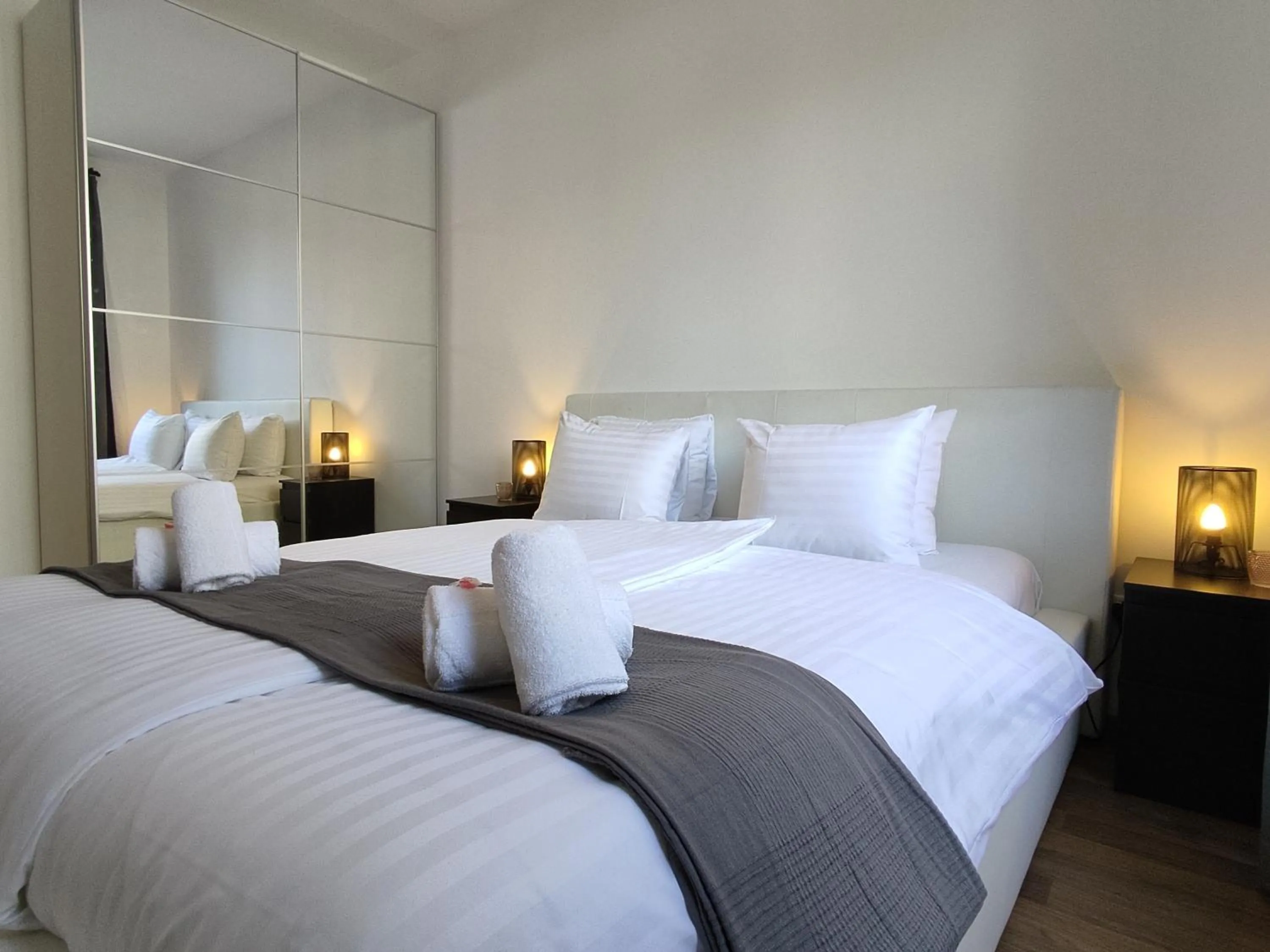 Bed in Corvin Center Suites