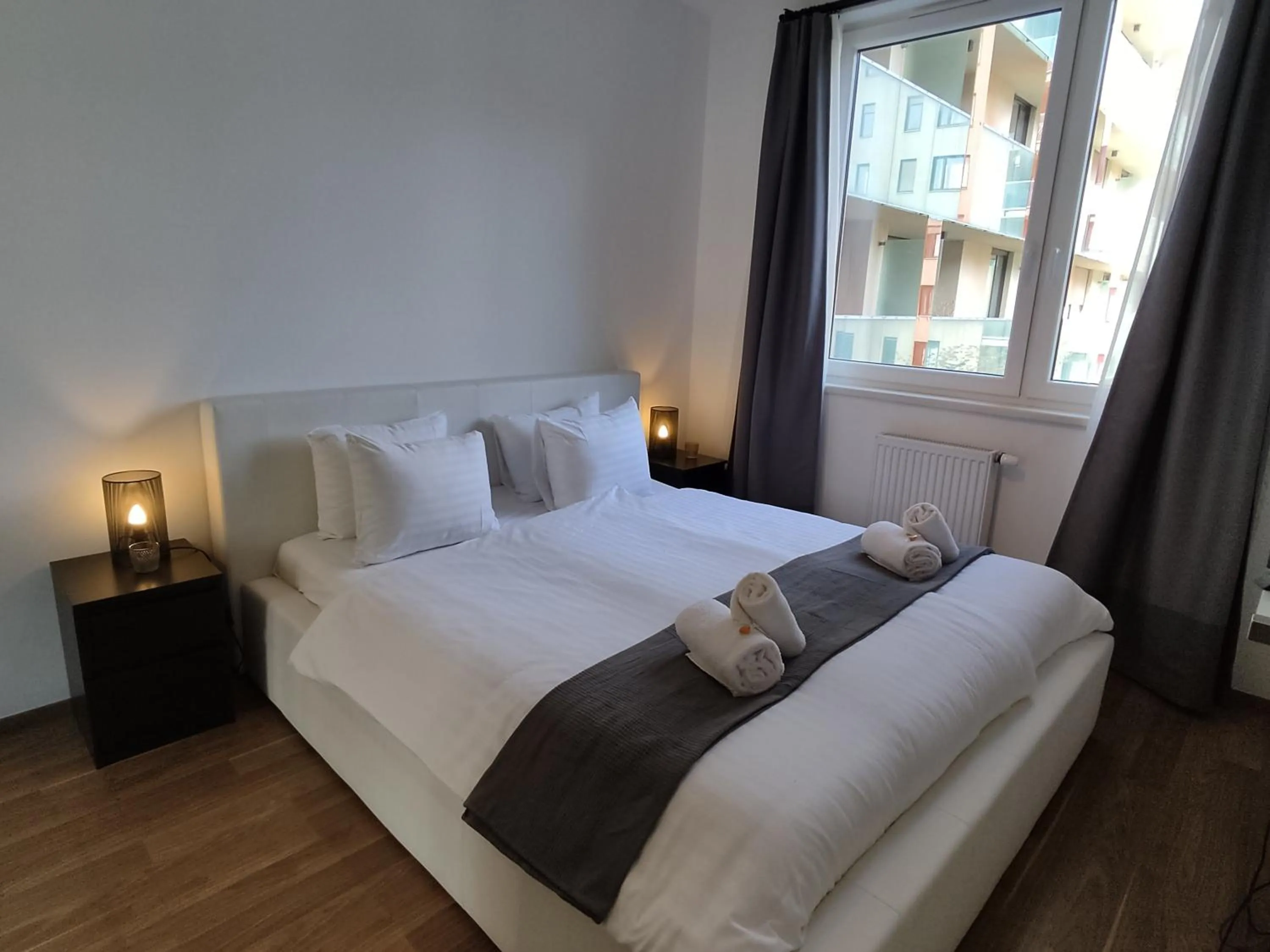 Bed in Corvin Center Suites