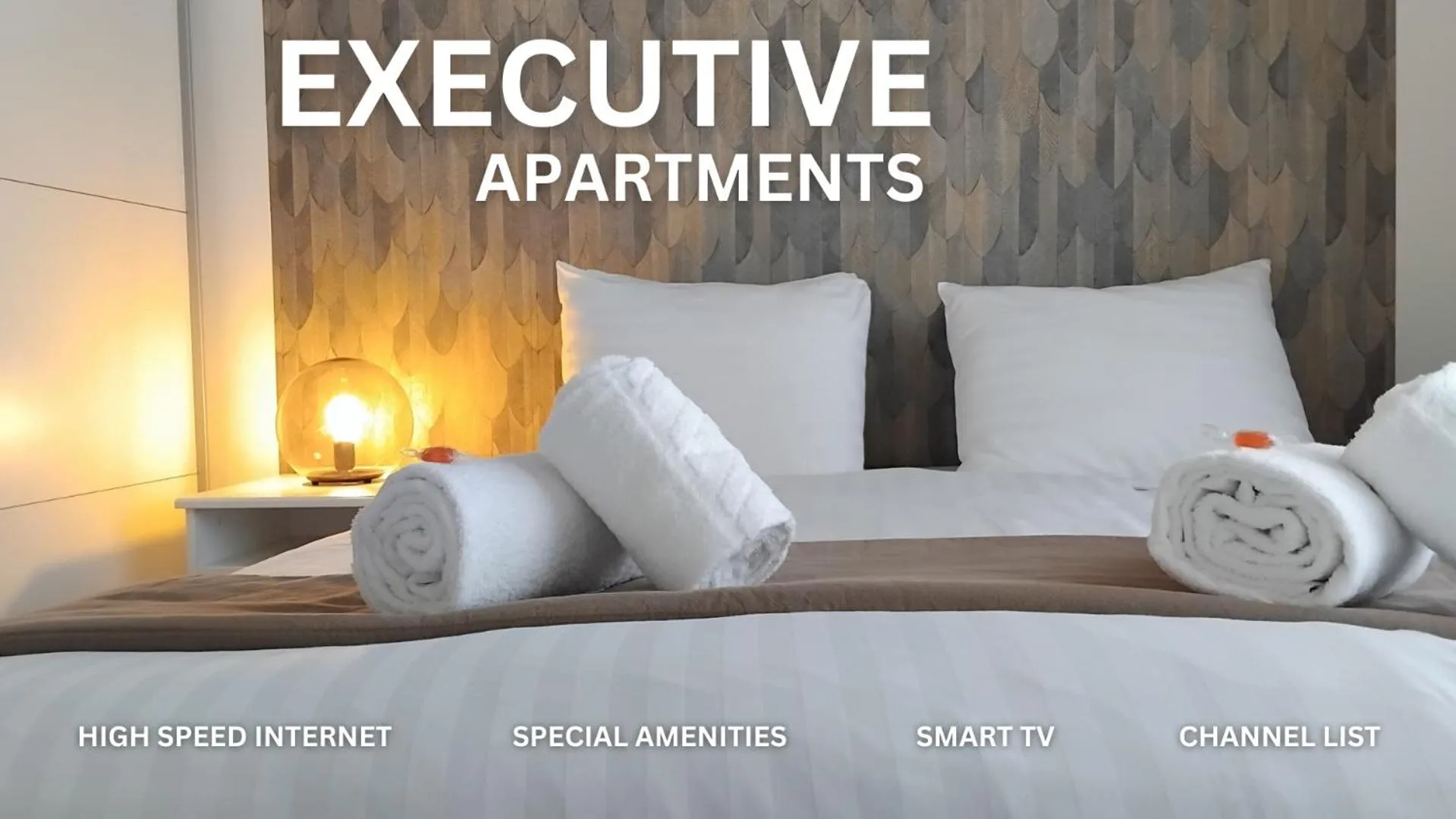 Bed in Corvin Center Suites