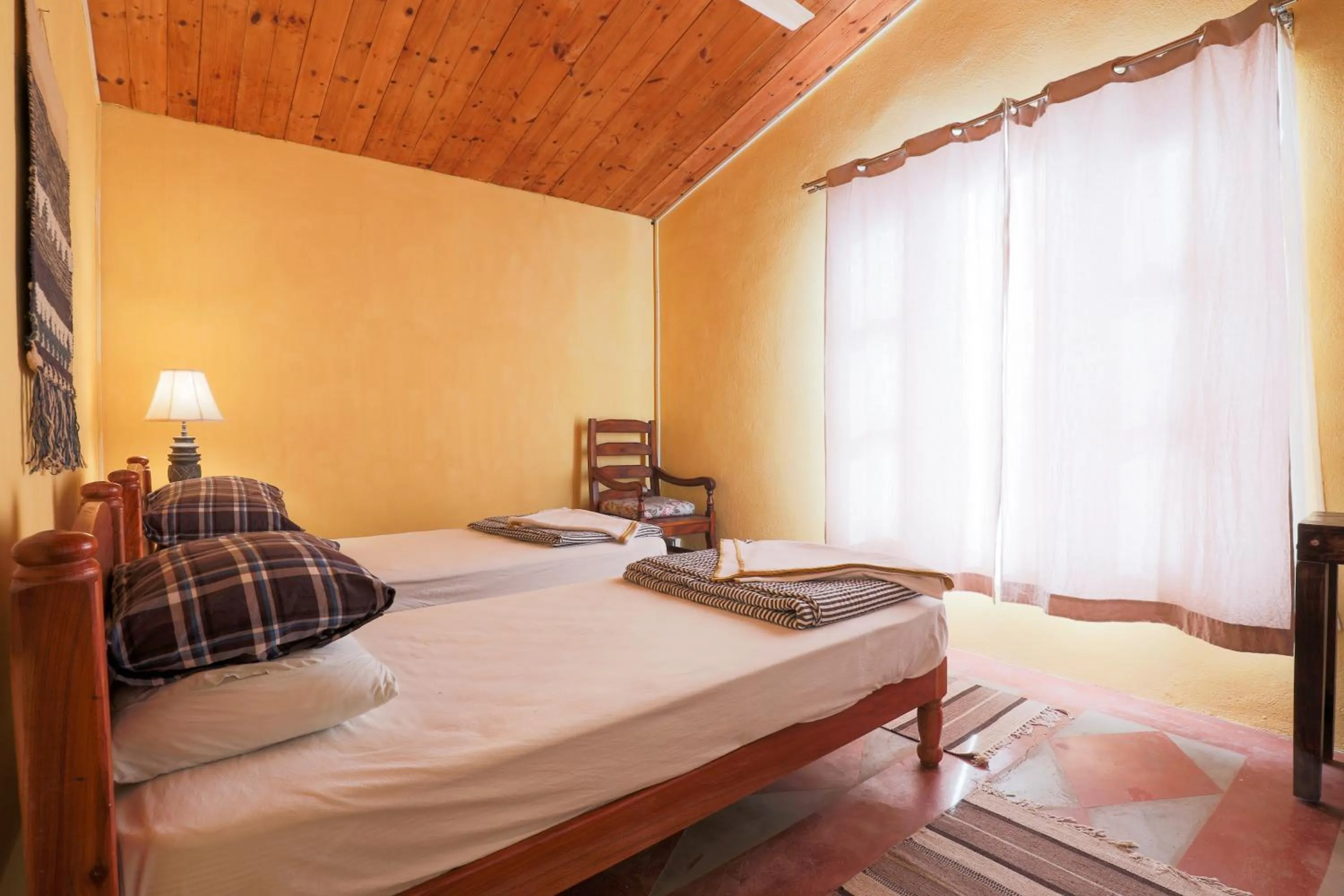 Bed in MANJARI RESORT