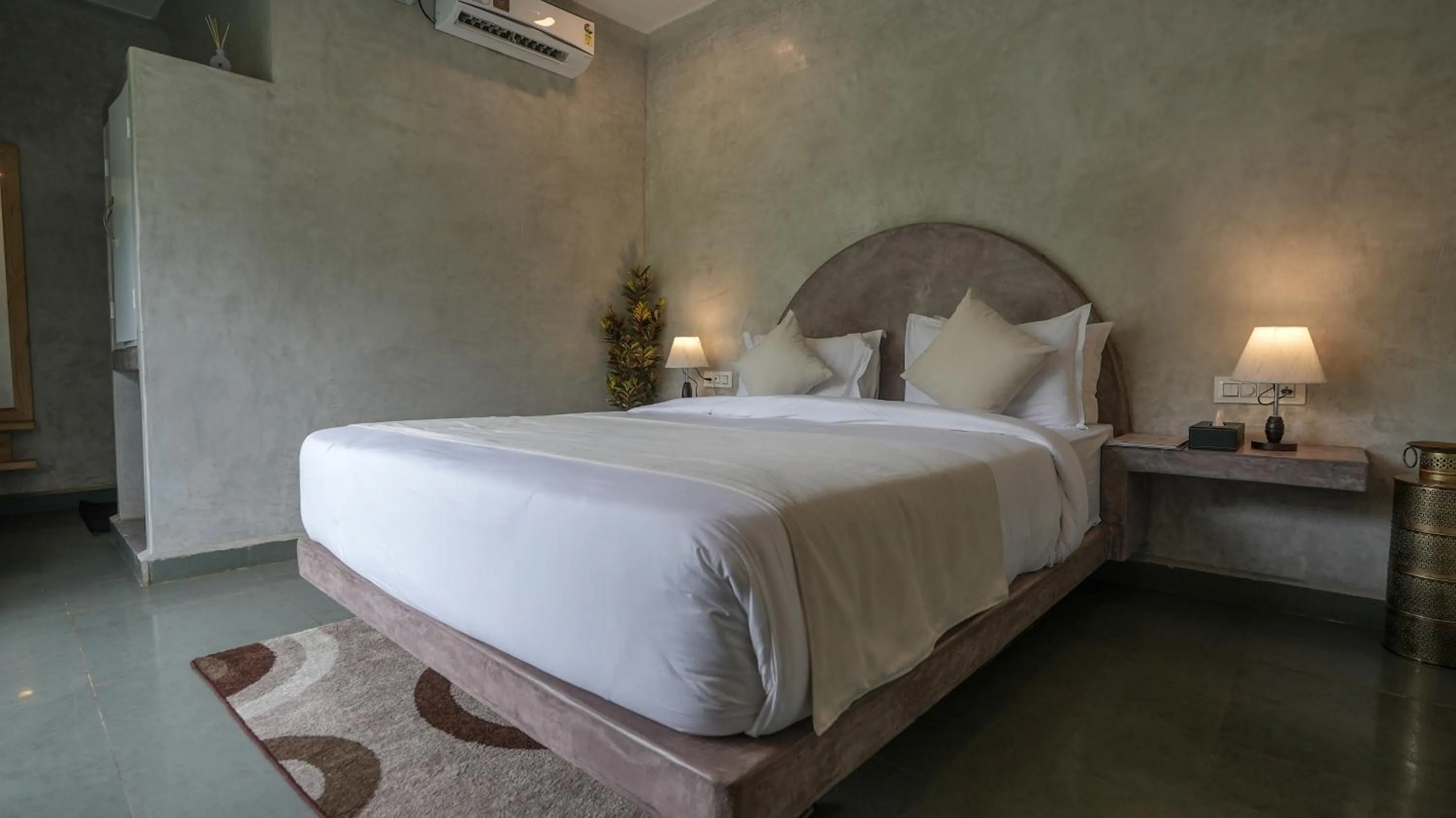 Bed in Whiteflower Resort Morjim