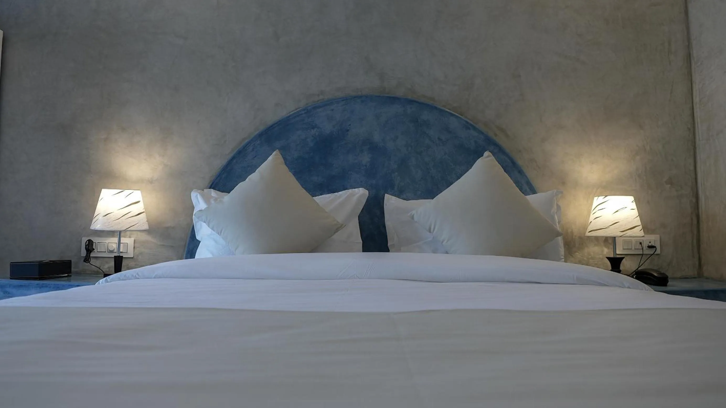 Bed in Whiteflower Resort Morjim