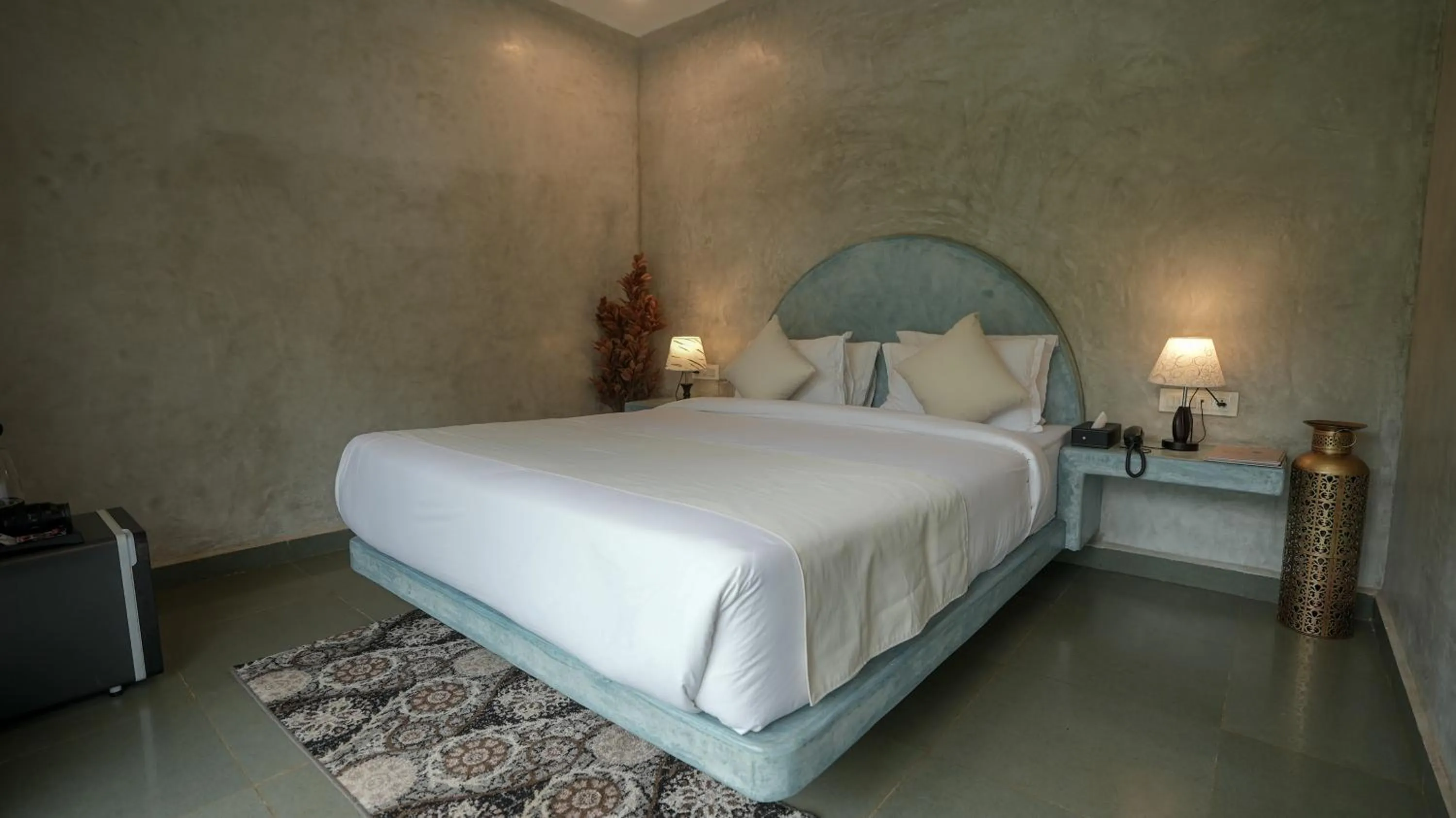 Bed in Whiteflower Resort Morjim