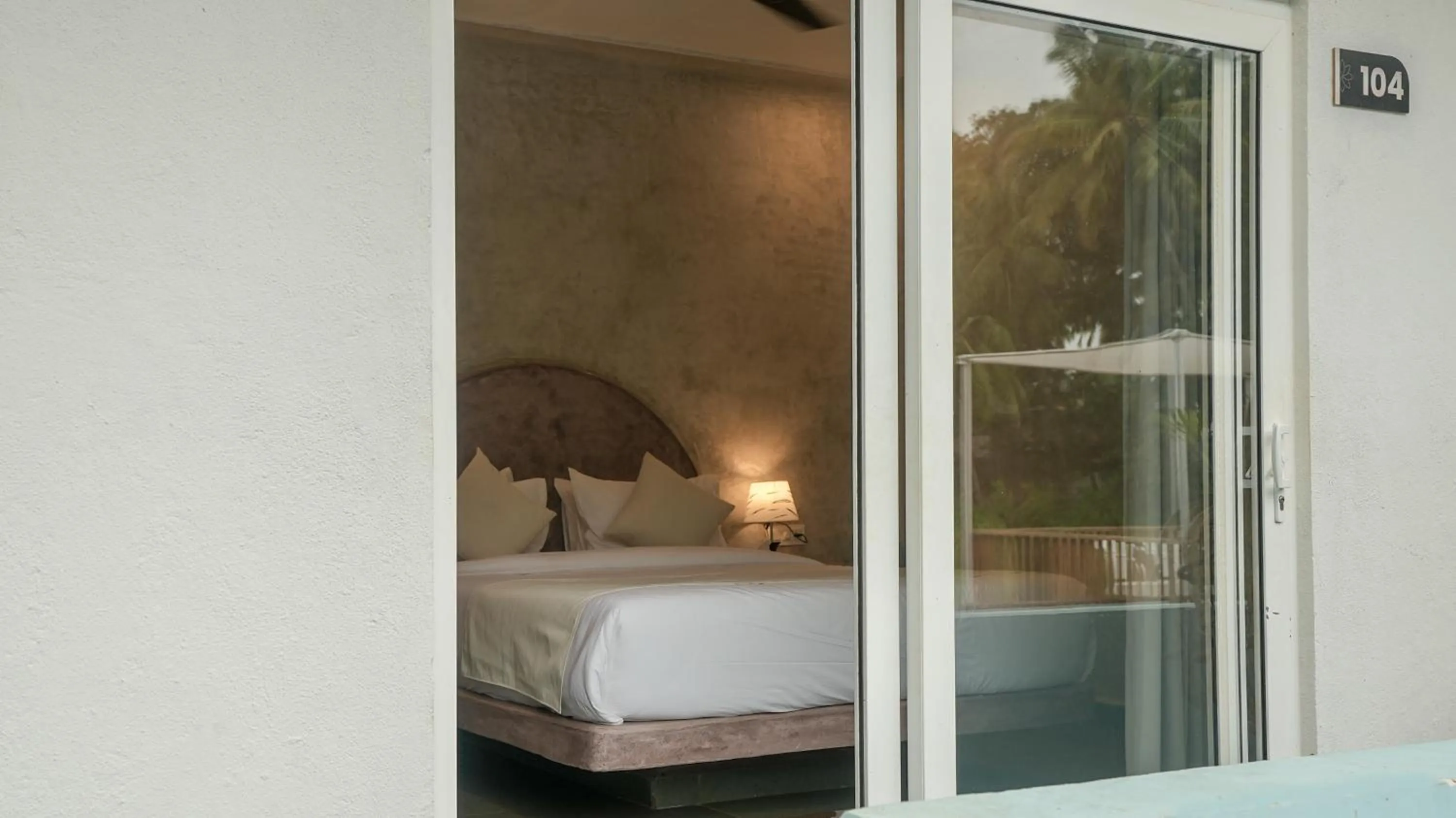 Bed in Whiteflower Resort Morjim