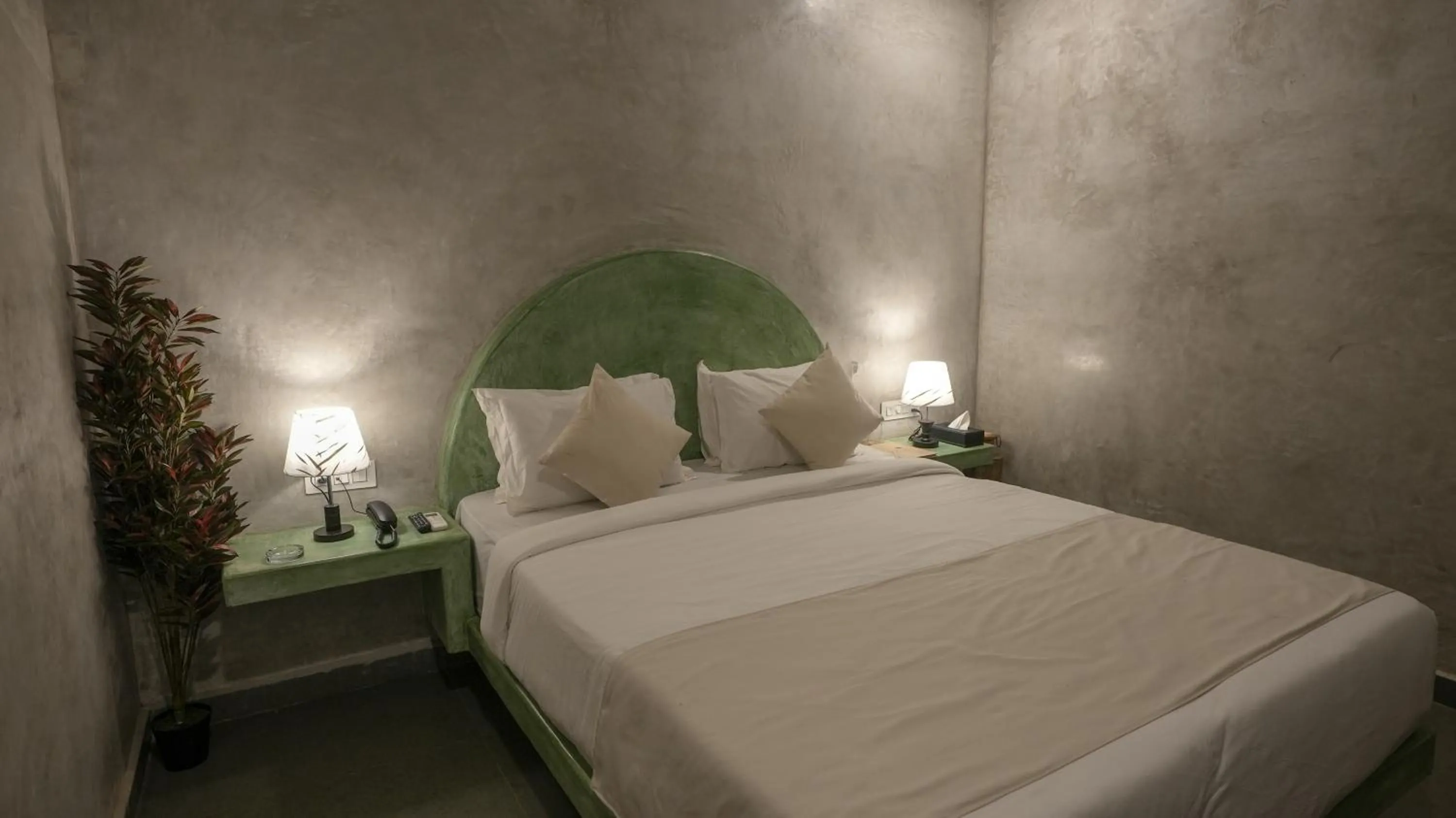 Bed in Whiteflower Resort Morjim