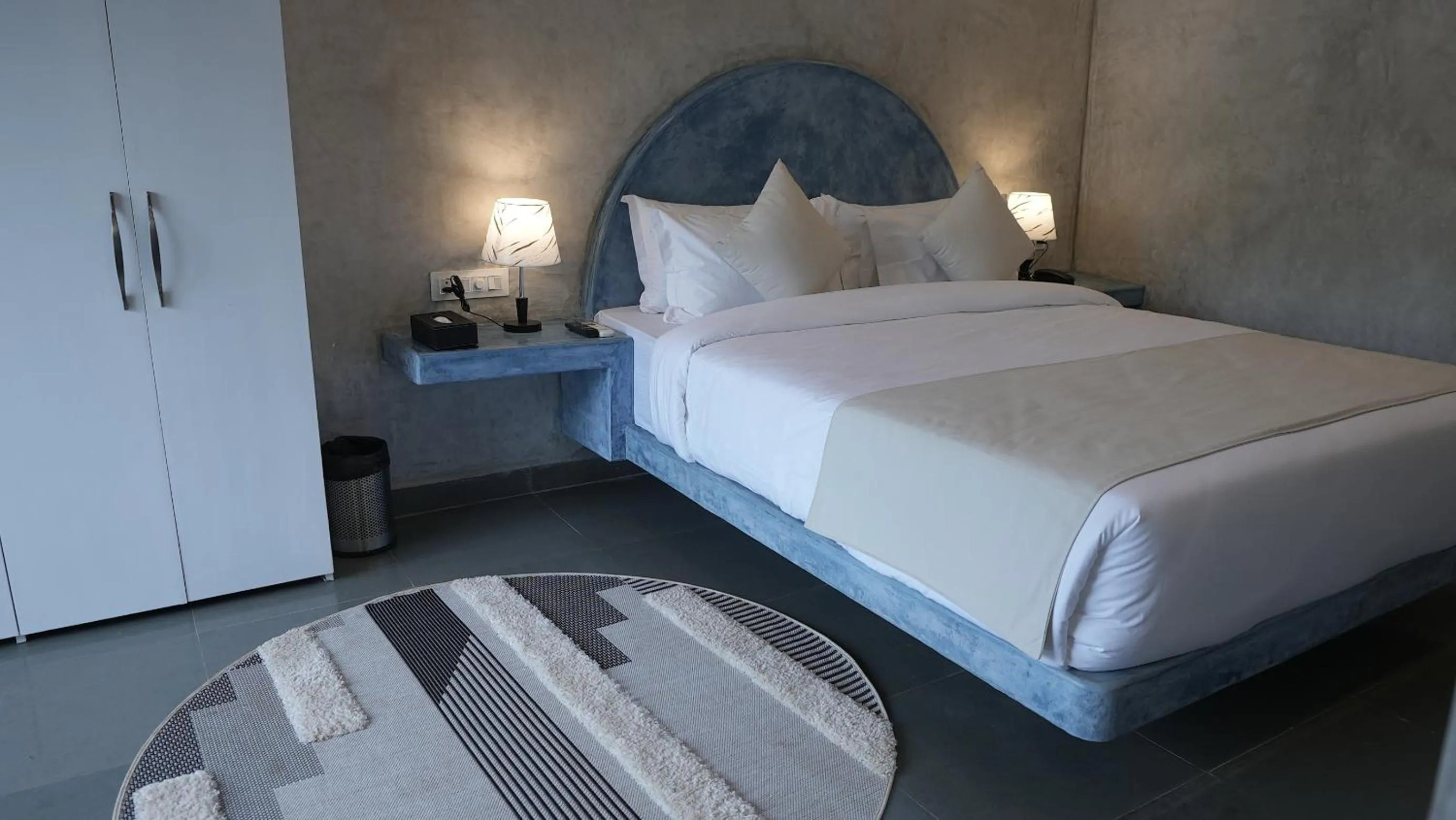 Bed in Whiteflower Resort Morjim