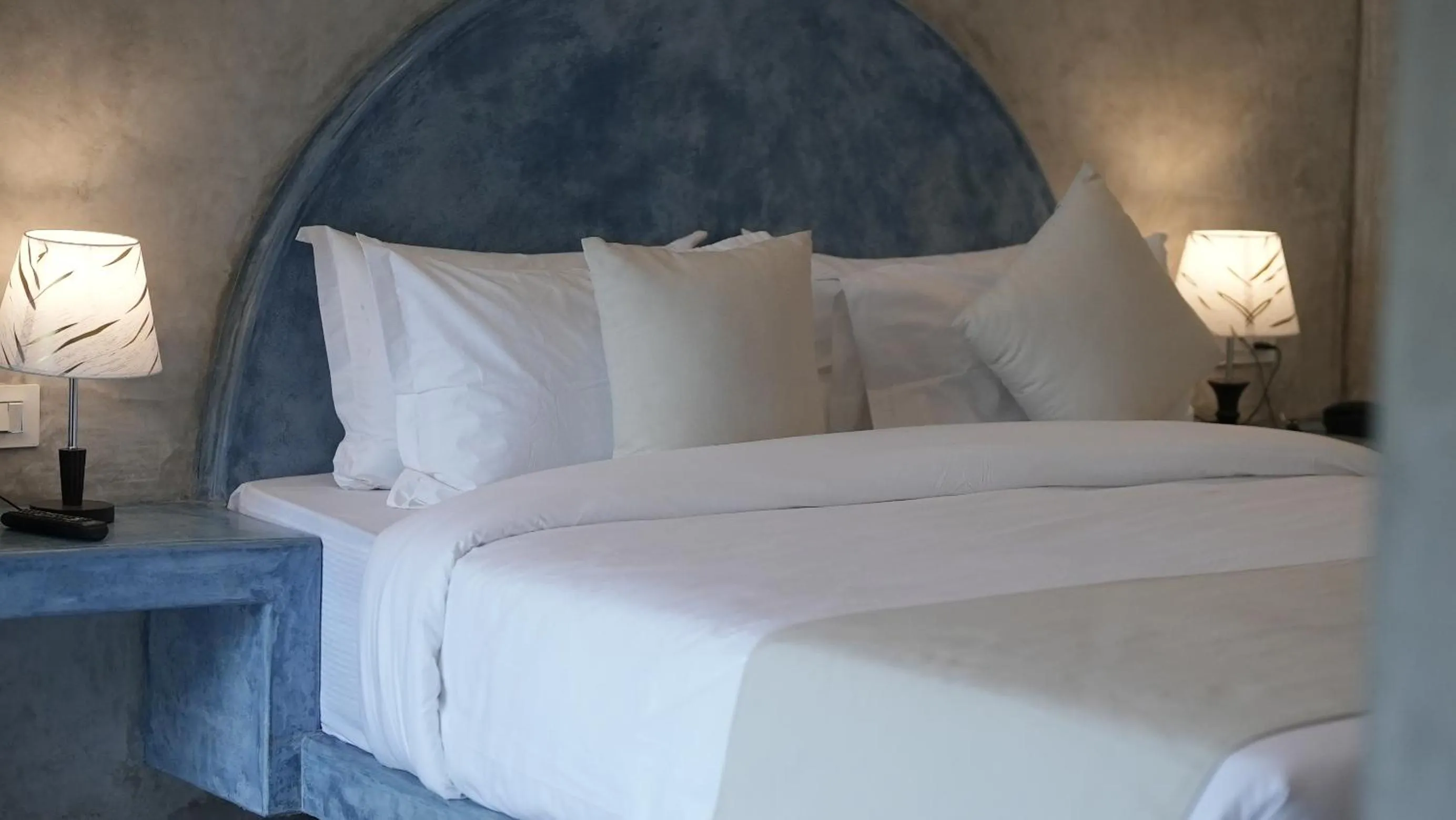 Bed in Whiteflower Resort Morjim