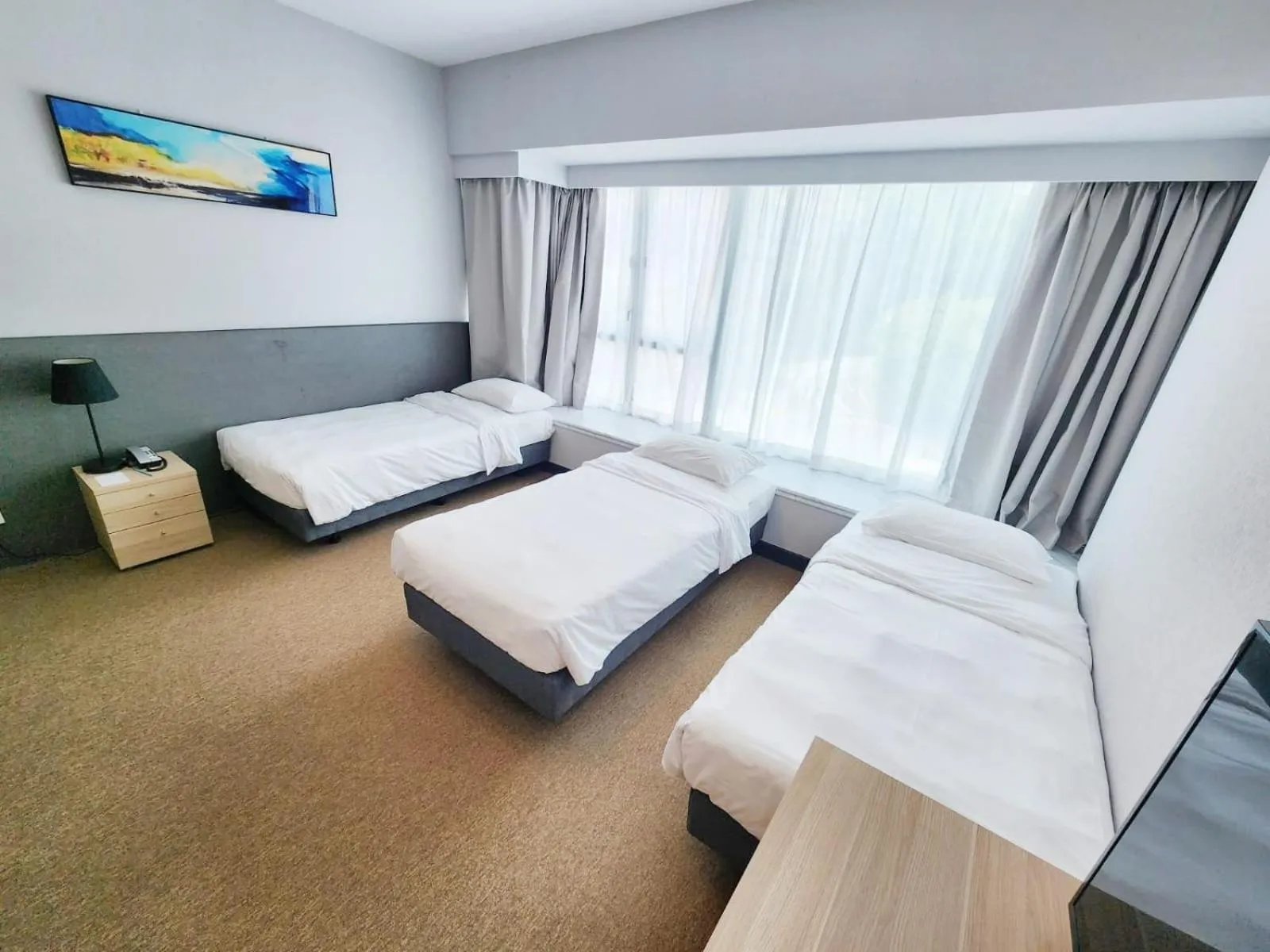 Bed in Grand Bay View Hotel