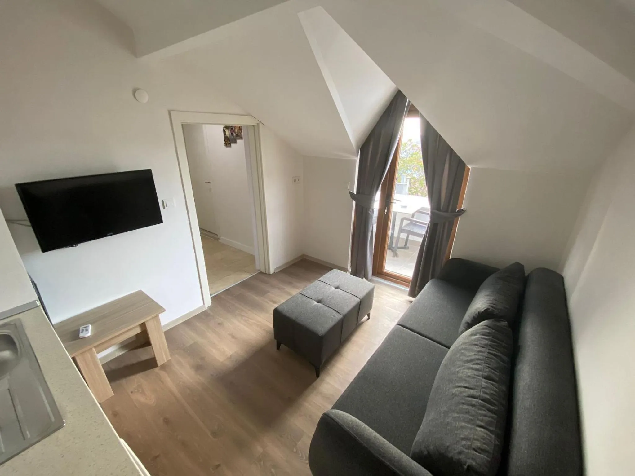 Communal lounge/ TV room in Elegance Suites