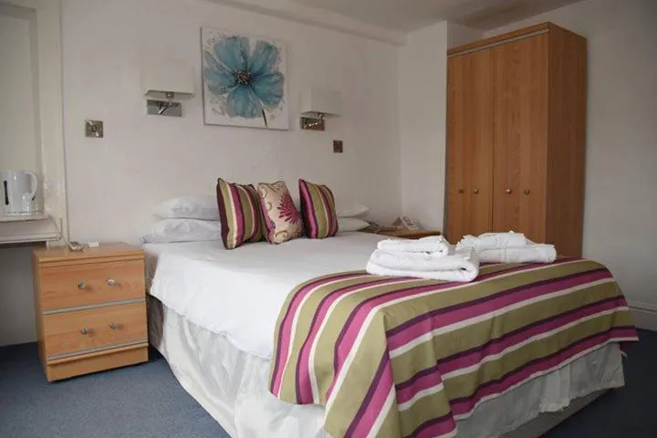 Bed in Harry's Hotel & Restaurant