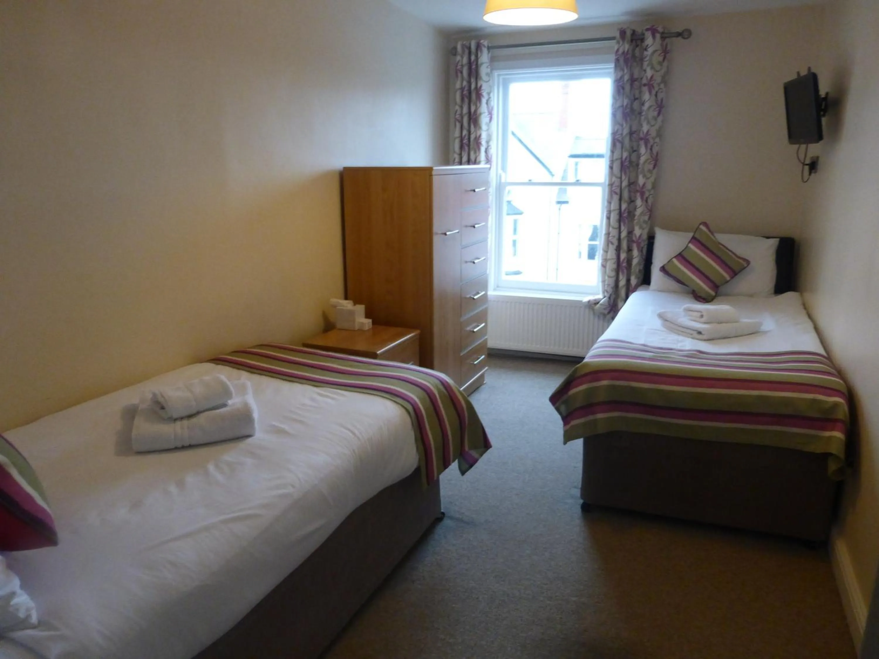 Bed in Harry's Hotel & Restaurant