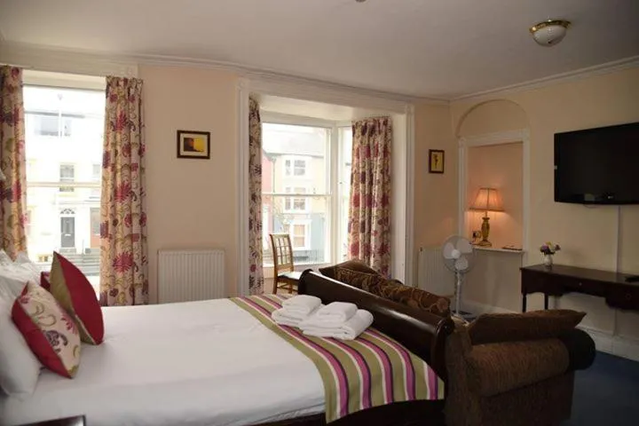 Bed in Harry's Hotel & Restaurant