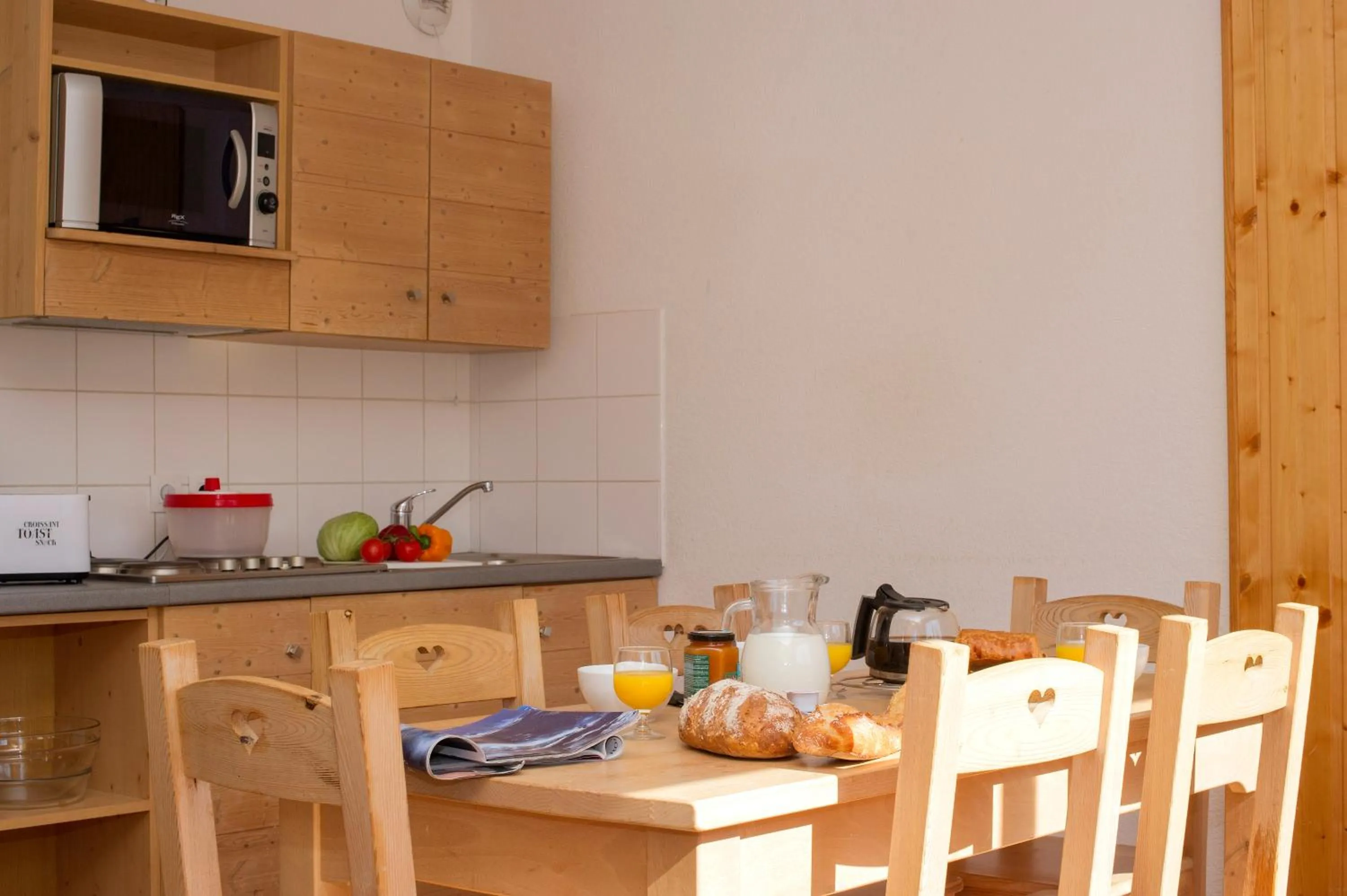 Kitchen or kitchenette in Résidence Goélia Le Balcon des Neiges