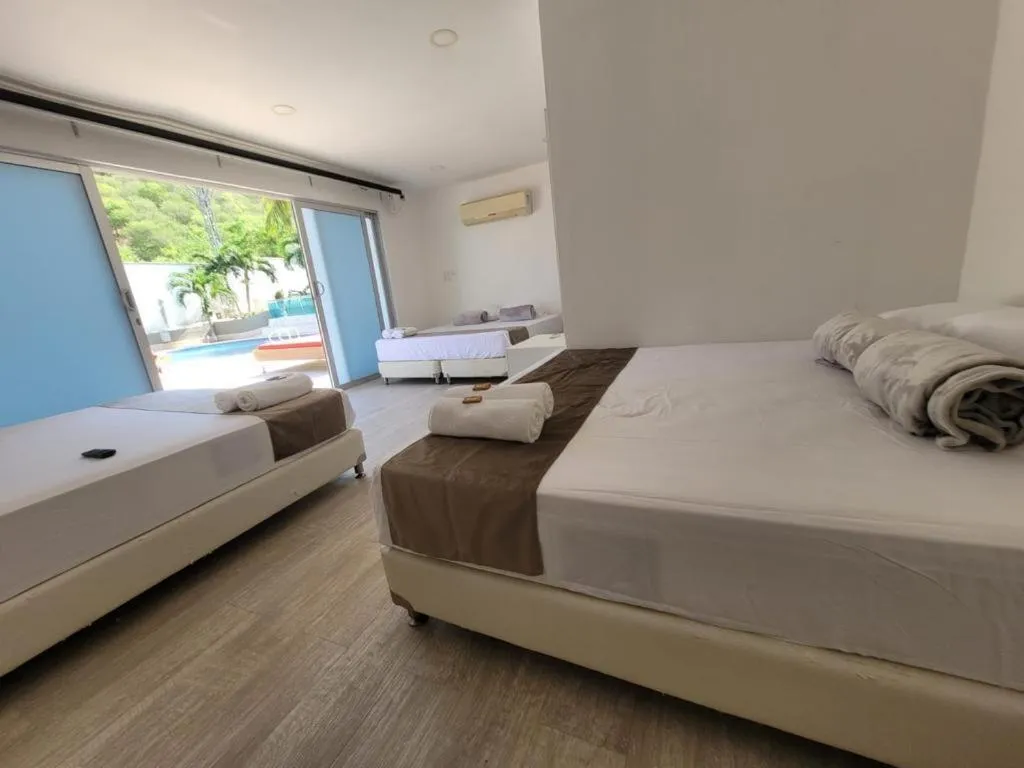 Bed in Hotel Kaamú Taganga