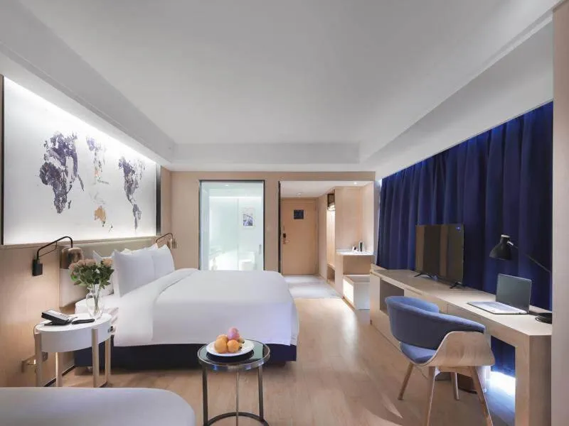 Bed in Kyriad Marvelous Hotel Suzhou Wujiang People Square