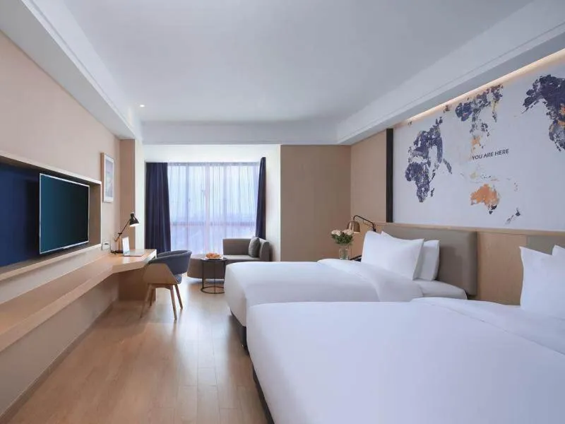 Bed in Kyriad Marvelous Hotel Suzhou Wujiang People Square