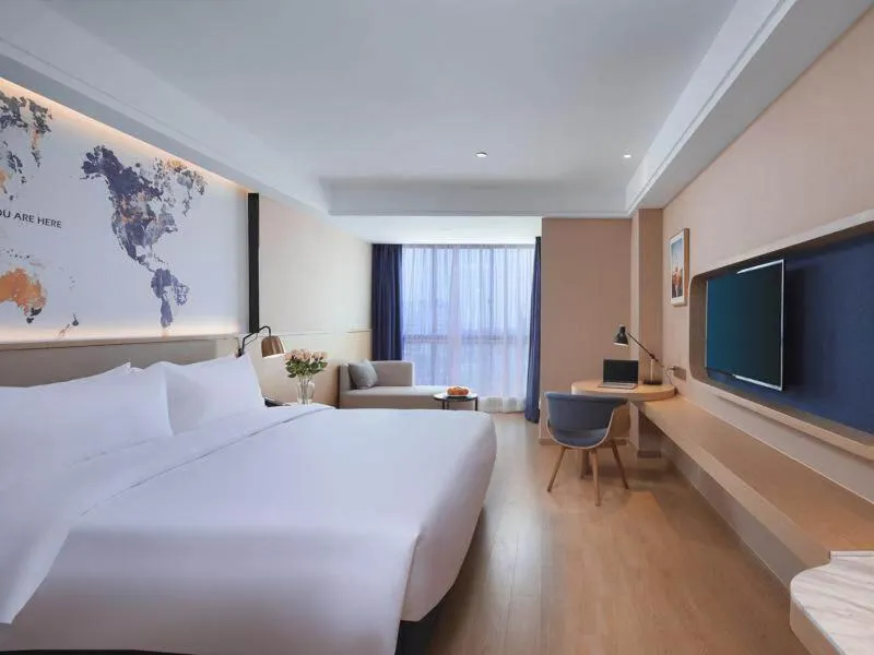Bed in Kyriad Marvelous Hotel Suzhou Wujiang People Square
