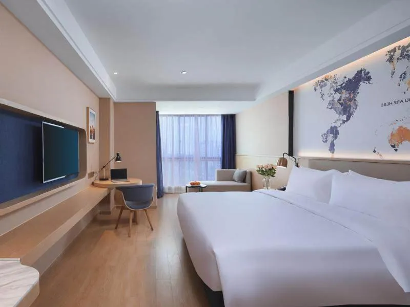 Bed in Kyriad Marvelous Hotel Suzhou Wujiang People Square