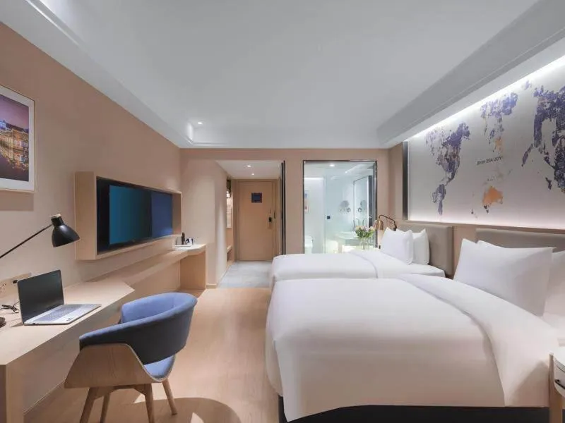 Bed in Kyriad Marvelous Hotel Suzhou Wujiang People Square