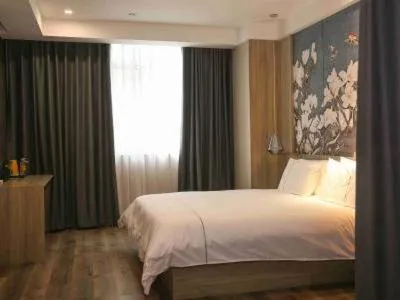 Bed in Magnolia Business Hotel Yangzhou Wanda Plaza Shunda Road
