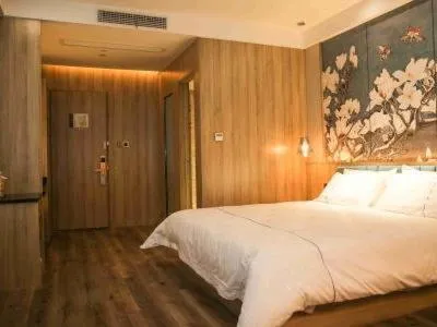 Bed in Magnolia Business Hotel Yangzhou Wanda Plaza Shunda Road