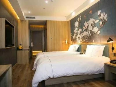 Bed in Magnolia Business Hotel Yangzhou Wanda Plaza Shunda Road
