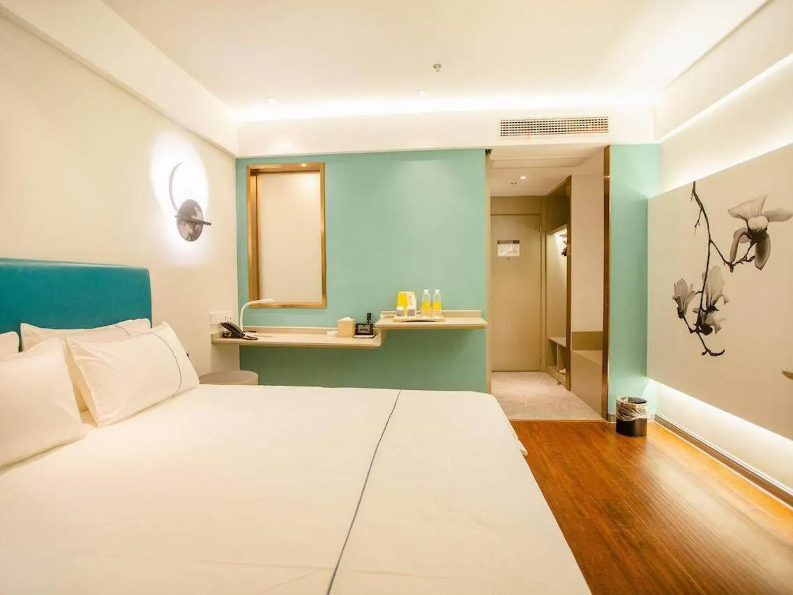 Bed in Magnotel Hotel Yangzhou Jinghua Wangyue Road