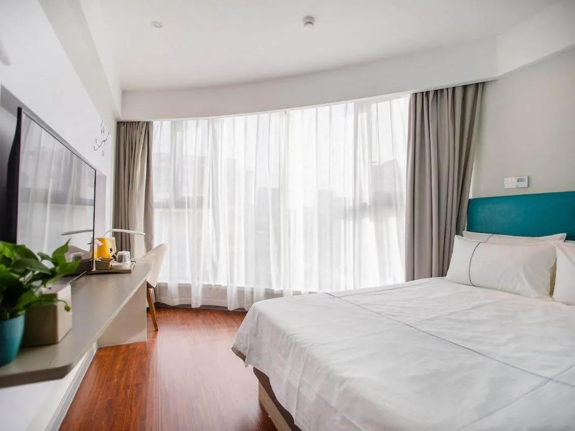 Bed in Magnotel Hotel Yangzhou Jinghua Wangyue Road