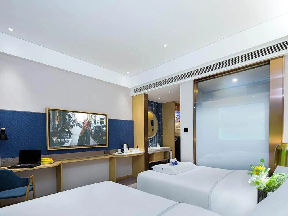 Bed in Kyriad Marvelous Hotel Weihai Happy Gate Weigao Plaza