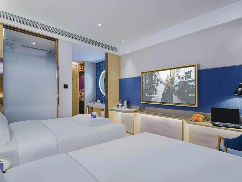 Bed in Kyriad Marvelous Hotel Weihai Happy Gate Weigao Plaza