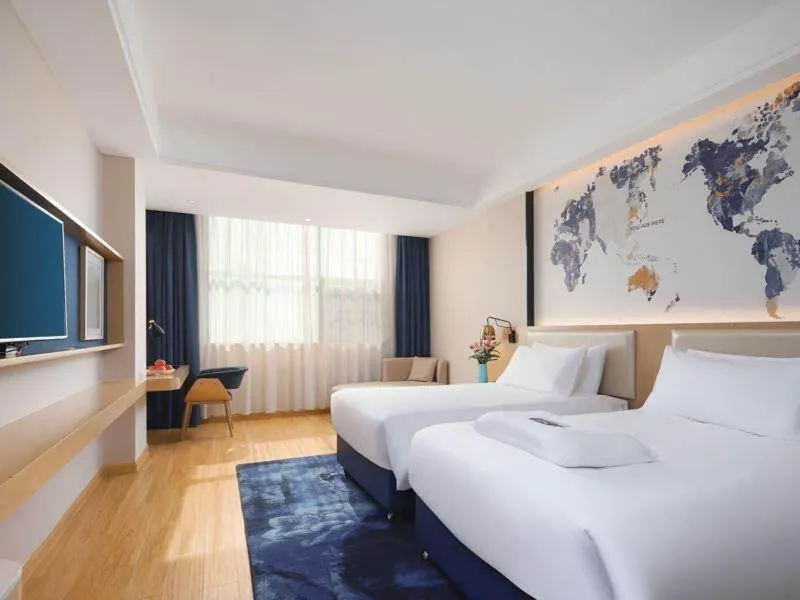 Bed in Kyriad Marvelous Hotel Yiyang Ziyang