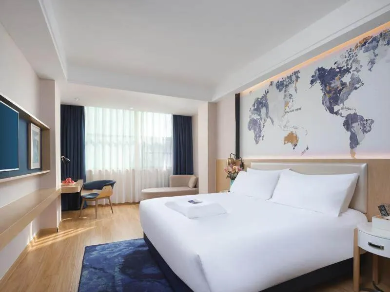 Bed in Kyriad Marvelous Hotel Yiyang Ziyang