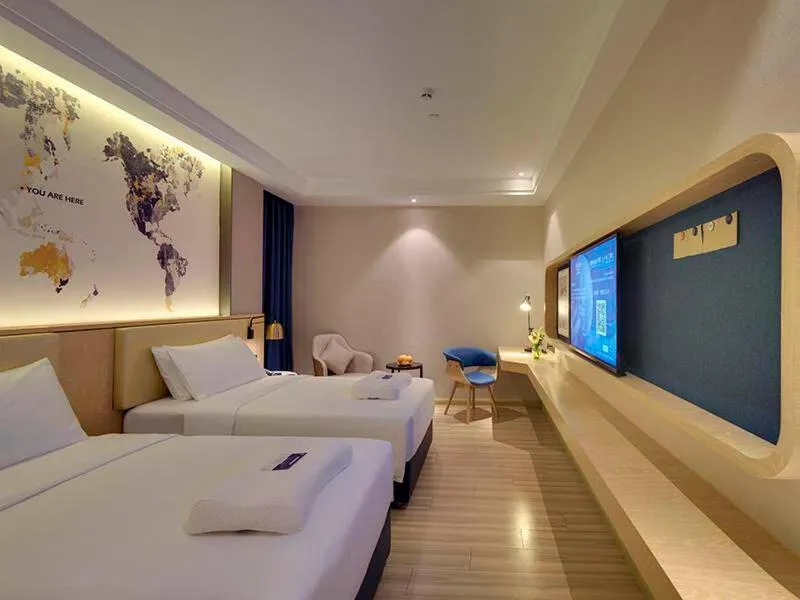 Bed in Kyriad Marvelous Hotel Guangzhou Baiyun International Airport