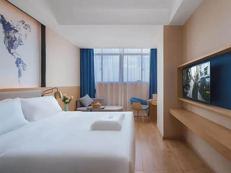 Bed in Kyriad Marvelous Hotel Huizhou Boluo Longxi