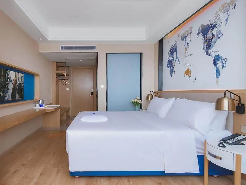 Bed in Kyriad Marvelous Hotel Huizhou Boluo Longxi