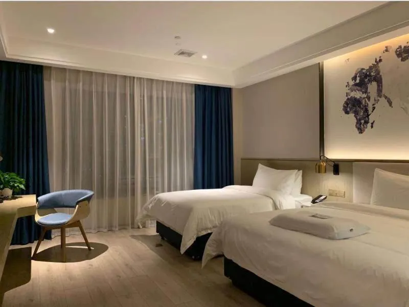 Bed in Kyriad Marvelous Hotel Heyuan Hakka Culture Park