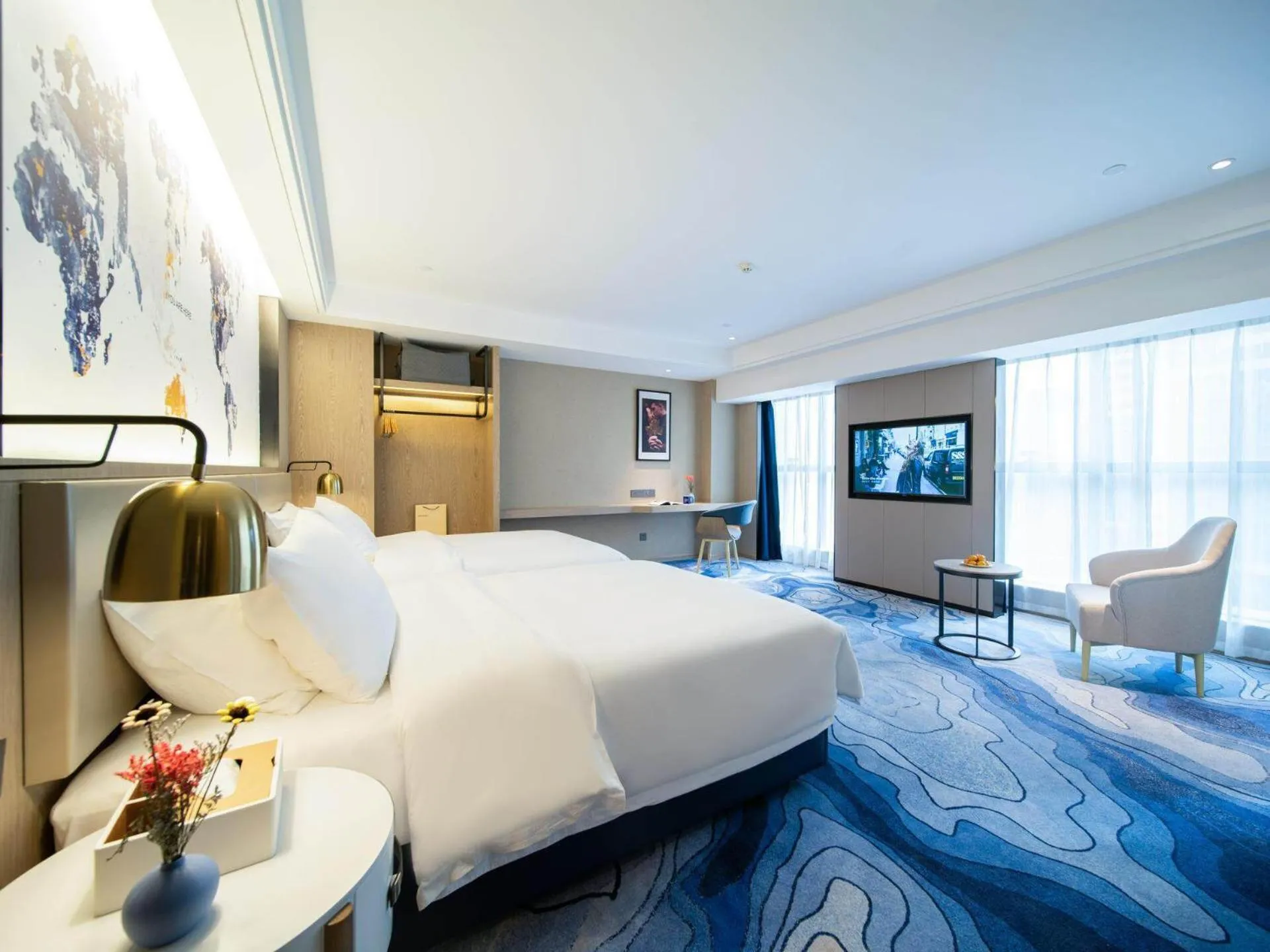 Bed in Kyriad Marvelous Hotel Heyuan Zijin Wanhui Plaza