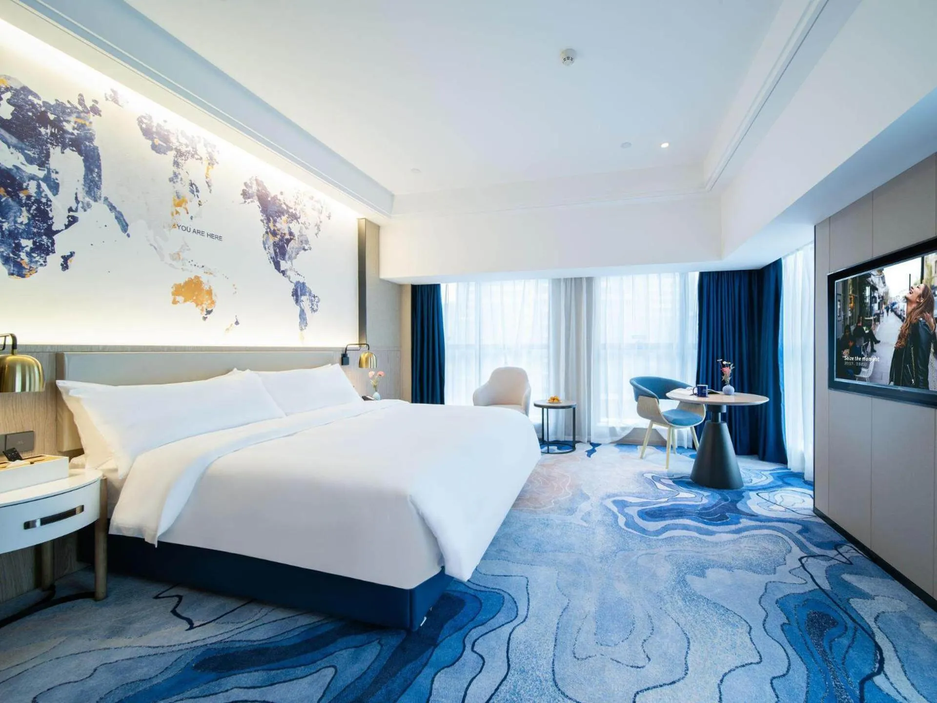 Bed in Kyriad Marvelous Hotel Heyuan Zijin Wanhui Plaza