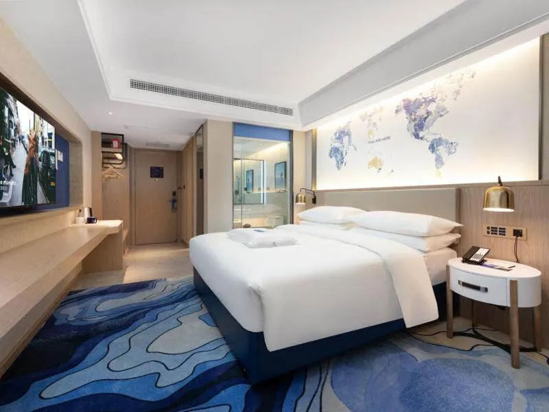 Bed in Kyriad Marvelous Hotel Heyuan Longchuan
