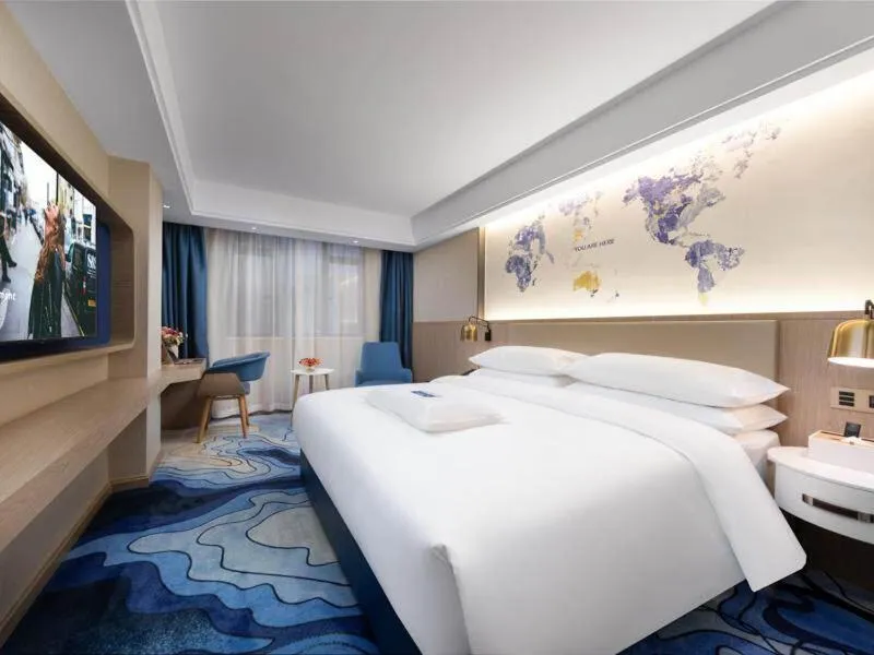 Bed in Kyriad Marvelous Hotel Heyuan Longchuan