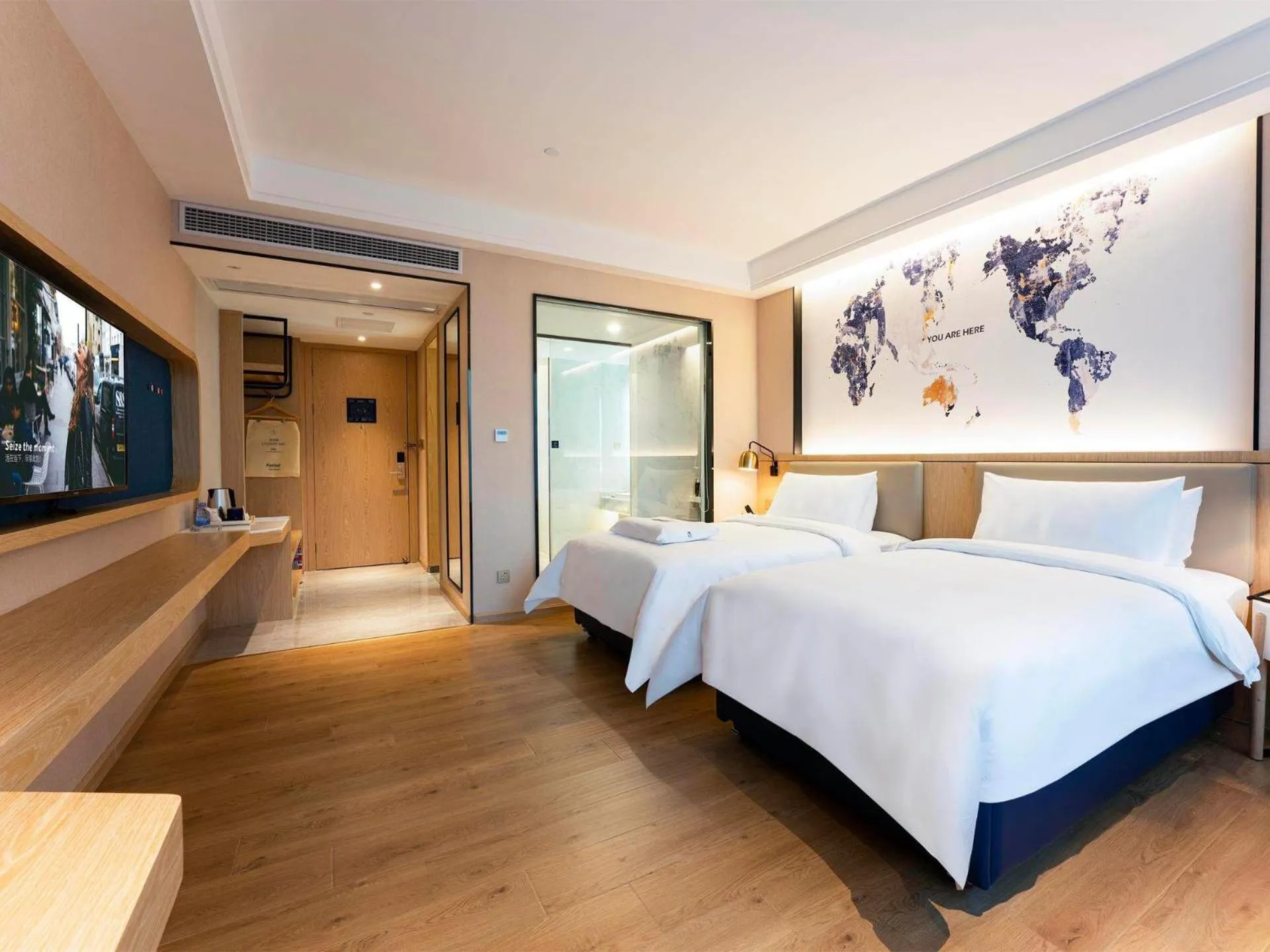 Bed in Kyriad Marvelous Hotel Heyuan Wanda Plaza