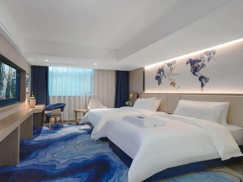 Bed in Kyriad Marvelous Hotel Shenzhen Guangming Zhenmei Subway Station