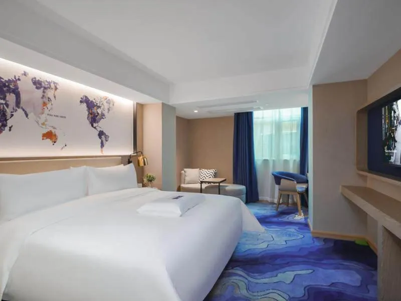 Bed in Kyriad Marvelous Hotel Shenzhen Guangming Zhenmei Subway Station