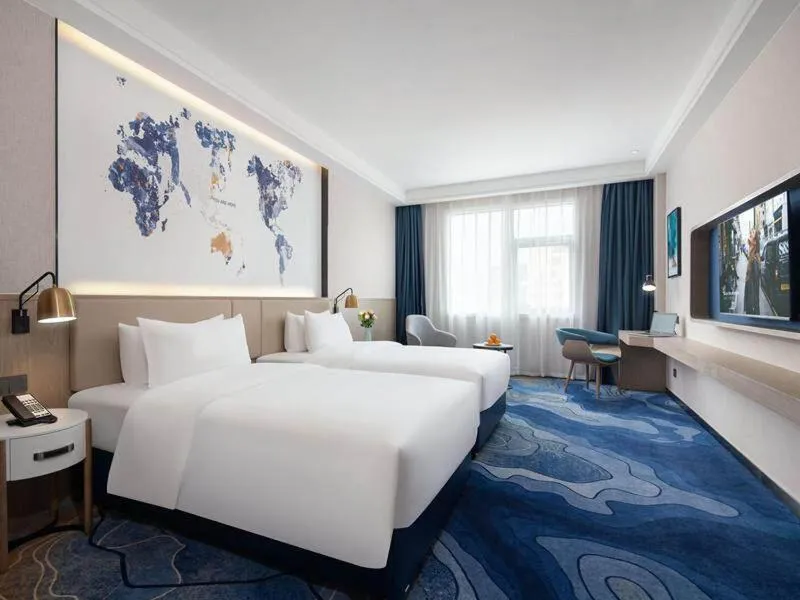 Bed in Kyriad Marvelous Hotel Shenzhen Baoan Gushu Metro Station