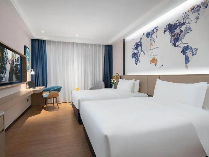 Bed in Kyriad Marvelous Hotel Shenzhen Baoan Gushu Metro Station