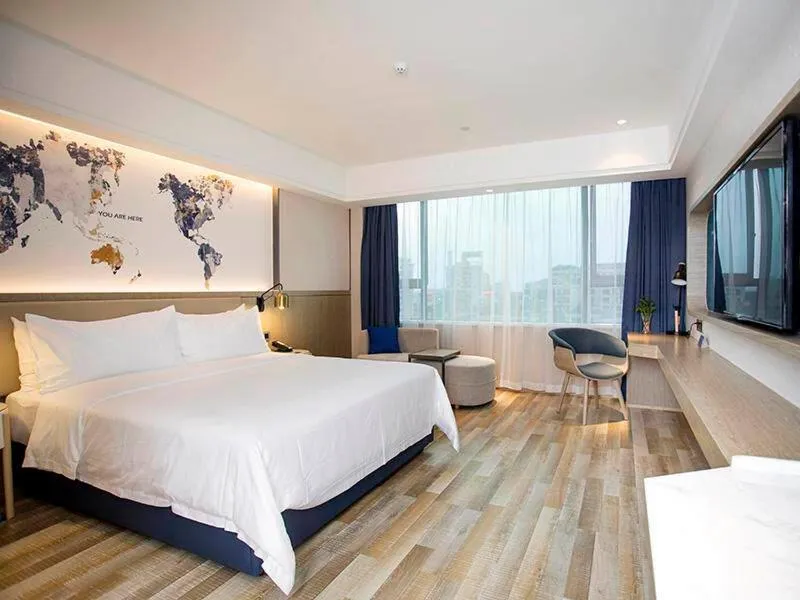 Bed in Kyriad Marvelous Hotel Foshan Xiqiao Mountain Scenic Area Qiaoling Square
